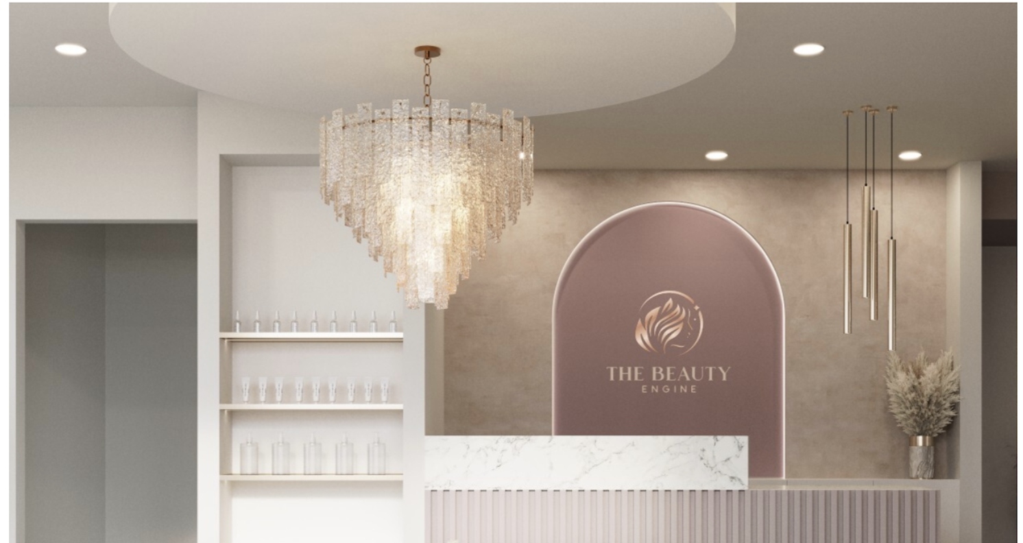 The Beauty Engine salon reception with crystal chandelier and marble counter